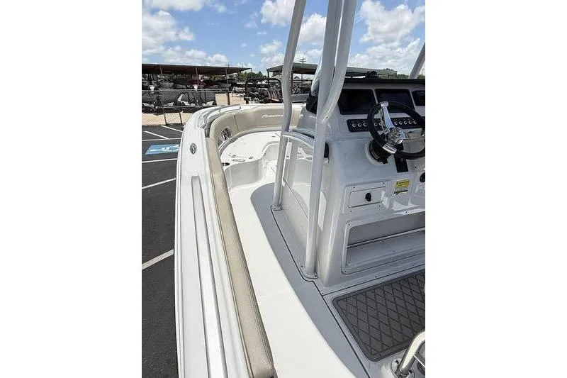 Slide: The Image of 2024 Finseeker 210 CC boat interior with steering console and seating area. - 9