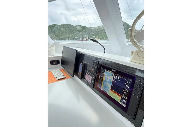 Slide: The Image of Modern yacht cockpit with navigation screens, Balance 526 model, 2021, overlooking scenic harbor. - 14