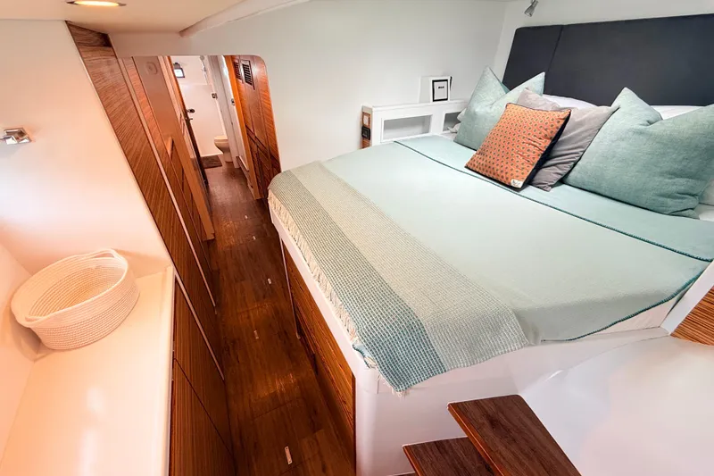 Slide: The Image of Luxurious bedroom interior of 2021 Balance 526 yacht with modern decor and wooden accents. - 16