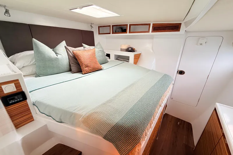 Slide: The Image of Luxurious bedroom interior of 2021 Balance 526 yacht with elegant bedding and wood accents. - 17