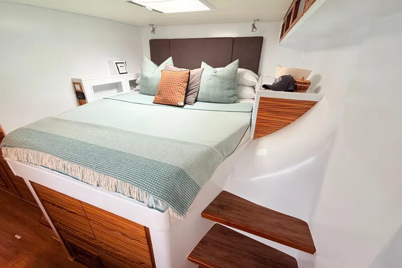 Slide: The Image of Luxurious bedroom interior on Balance 526 yacht, featuring a cozy bed and elegant wooden accents. - 18