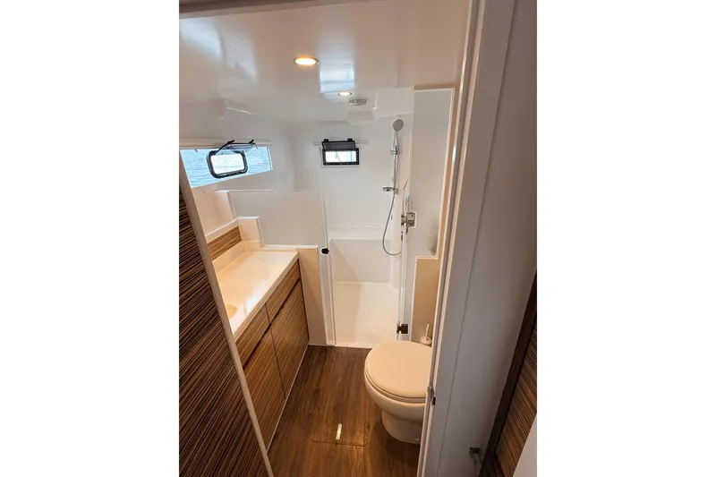 Slide: The Image of Modern bathroom in 2021 Balance 526 yacht with wood accents and compact design. - 19