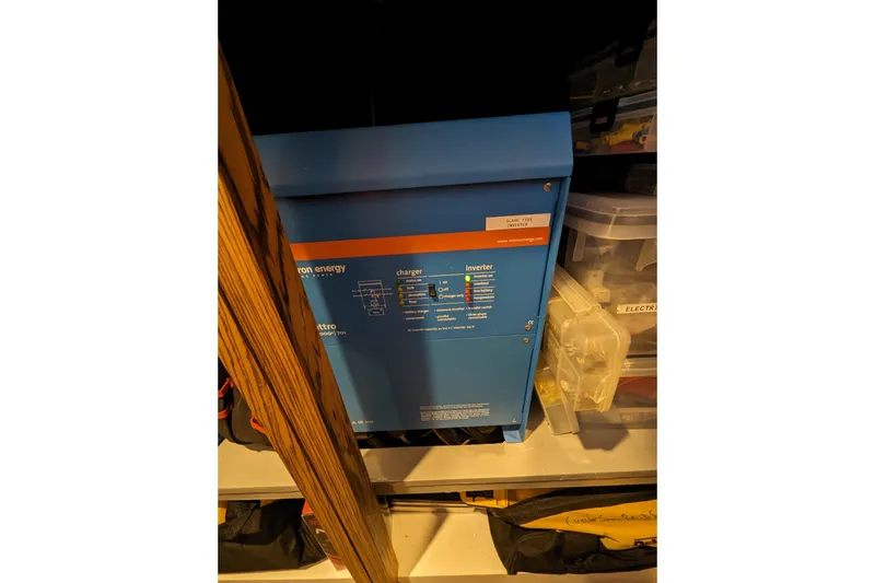 Slide: The Image of Blue Balance 526 inverter, model year 2021, stored on a shelf with tools. - 33