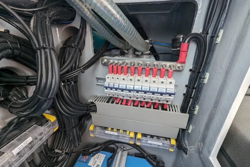 Slide: The Image of Electrical panel with circuit breakers and wiring in a 2021 Balance 526 model. - 35