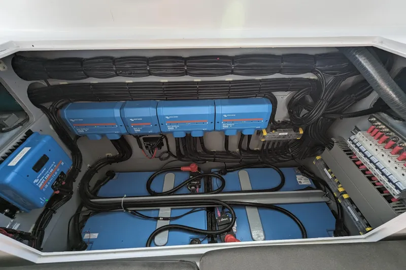 Slide: The Image of Electrical system setup in a 2021 Balance 526 model, featuring blue inverters and batteries. - 36