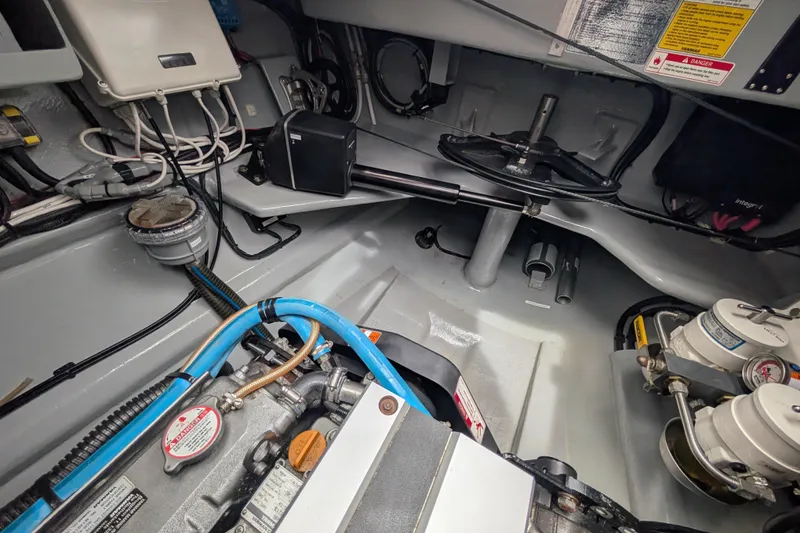 Slide: The Image of Engine room of a 2021 Balance 526 yacht, showcasing mechanical components and wiring. - 38