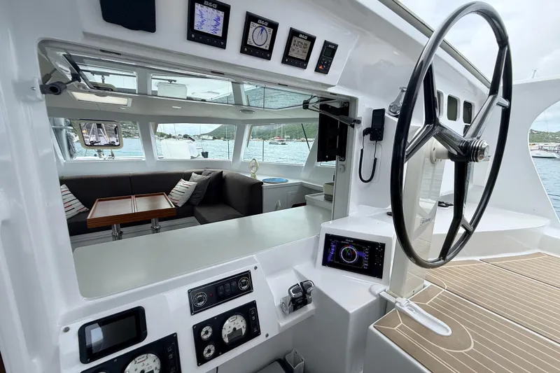 Slide: The Image of Interior view of 2021 Balance 526 yacht cockpit with steering wheel and navigation instruments. - 4