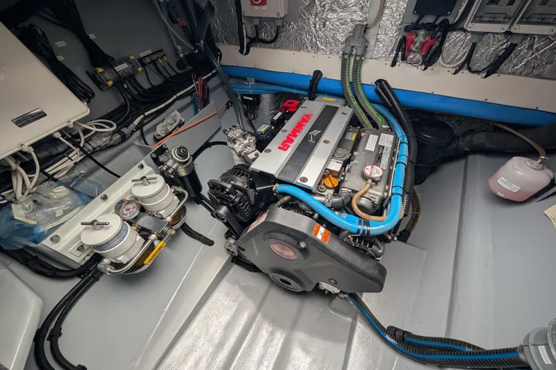 Slide: The Image of Engine room of a 2021 Balance 526 yacht, featuring a Yanmar engine and wiring. - 41
