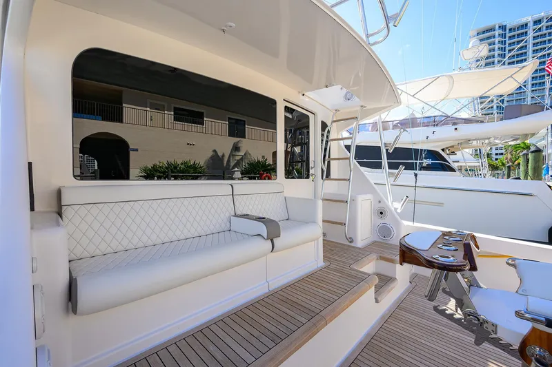 Slide: The Image of Luxurious 2007 Viking 56 Convertible yacht with elegant seating and modern amenities. - 13