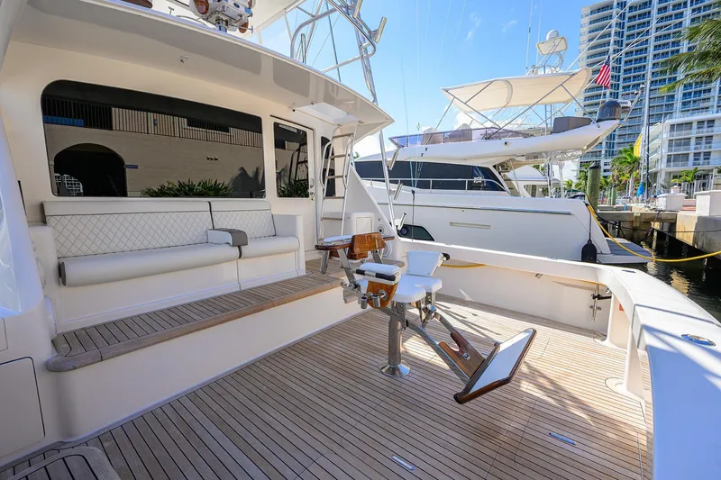 Slide: The Image of 2007 Viking 56 Convertible yacht with spacious deck and luxurious seating. - 14