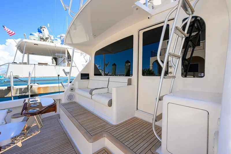 Slide: The Image of 2007 Viking 56 Convertible yacht with spacious deck and seating area. - 17