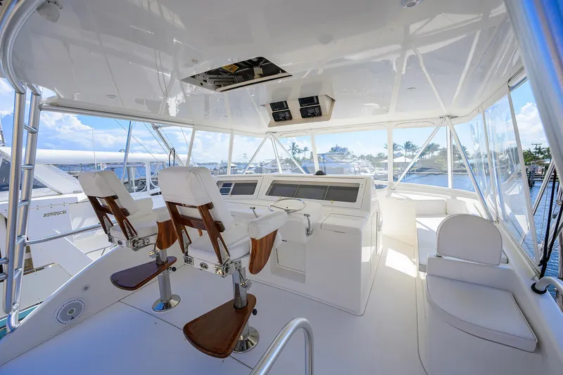 Slide: The Image of 2007 Viking 56 Convertible yacht bridge with helm, seating, and panoramic views. - 22