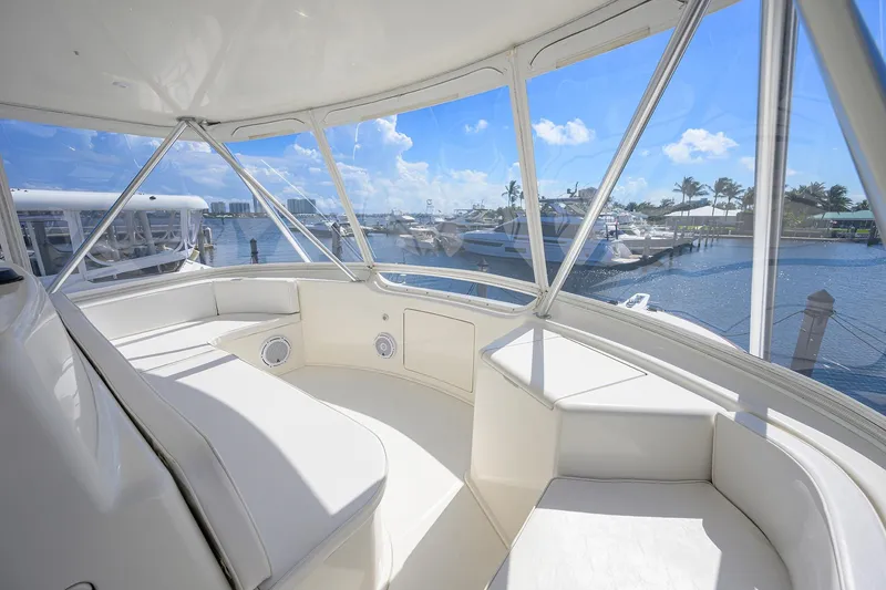 Slide: The Image of Interior view of 2007 Viking 56 Convertible yacht with marina backdrop. - 25