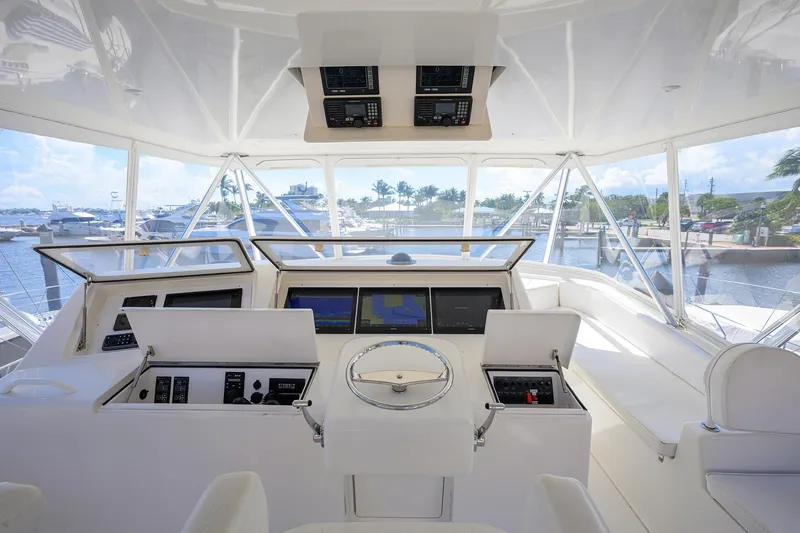 Slide: The Image of Helm of 2007 Viking 56 Convertible yacht with navigation screens and controls. - 28