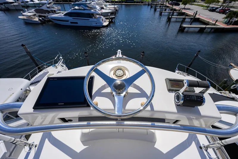 Slide: The Image of Helm of 2007 Viking 56 Convertible yacht with navigation equipment, overlooking marina. - 33