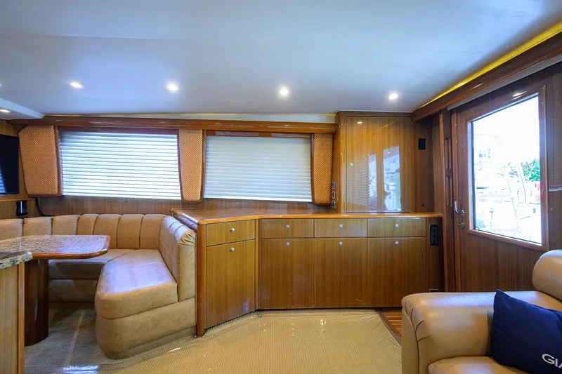 Slide: The Image of Luxurious interior of 2007 Viking 56 Convertible yacht with elegant wood finishes and plush seating. - 35