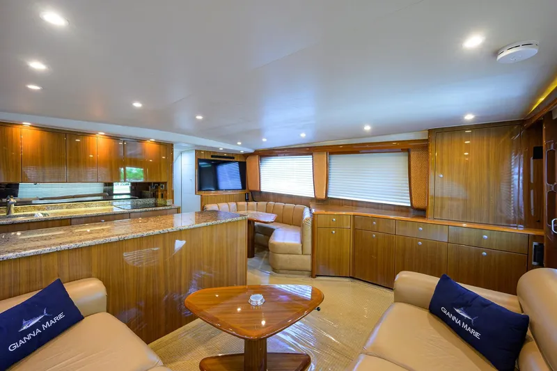 Slide: The Image of Luxurious interior of a 2007 Viking 56 Convertible yacht with elegant wood finishes. - 36