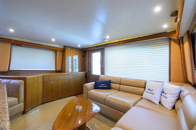 Slide: The Image of Luxurious interior of 2007 Viking 56 Convertible yacht with leather seating and wooden cabinetry. - 37