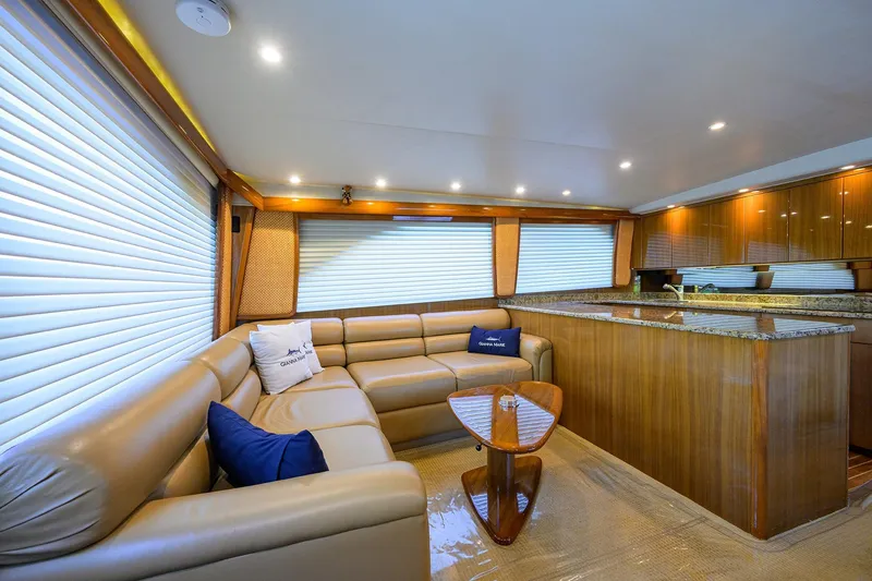 Slide: The Image of Luxurious interior of 2007 Viking 56 Convertible yacht with leather seating and wooden accents. - 40