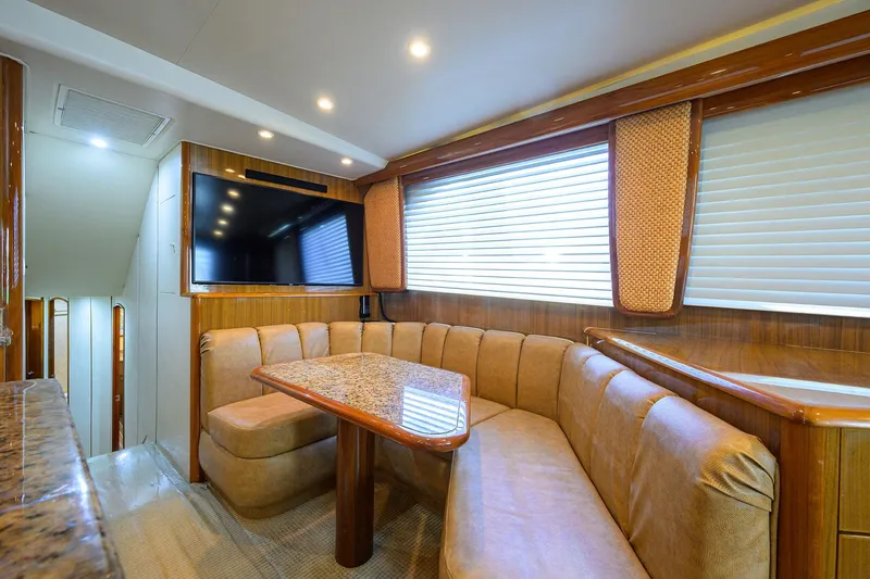 Slide: The Image of Luxurious interior of 2007 Viking 56 Convertible yacht with plush seating and large TV. - 41