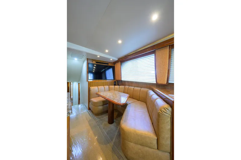 Slide: The Image of Luxurious interior of 2007 Viking 56 Convertible yacht with plush seating and TV. - 44