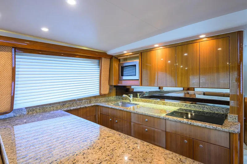 Slide: The Image of Luxurious kitchen interior of 2007 Viking 56 Convertible yacht with granite countertops. - 45