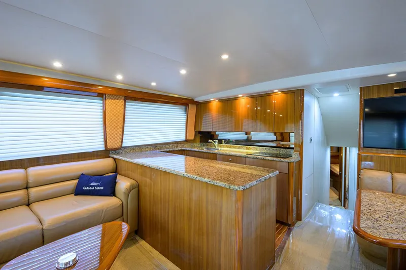 Slide: The Image of Luxurious interior of a 2007 Viking 56 Convertible yacht with elegant wood finishes. - 46