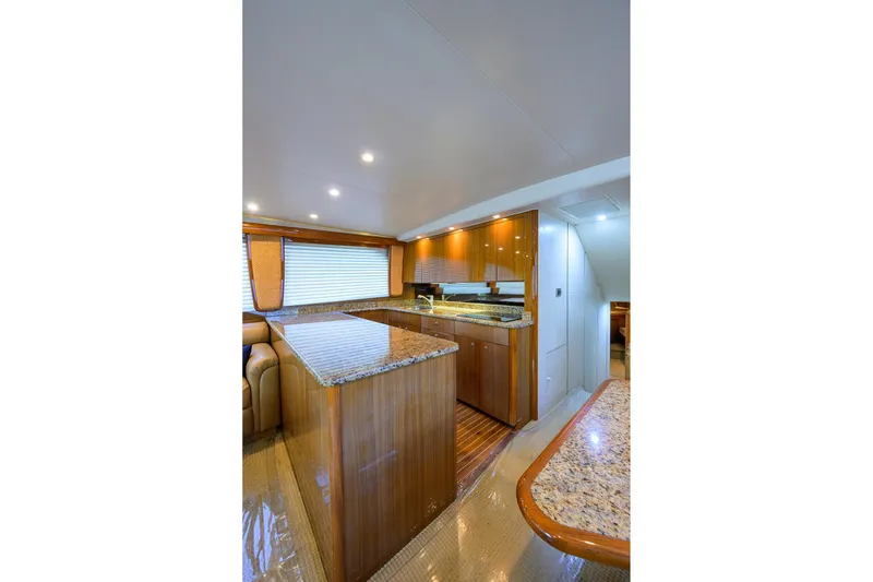Slide: The Image of Luxurious kitchen interior of 2007 Viking 56 Convertible yacht with granite countertops. - 48