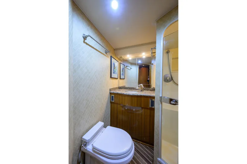 Slide: The Image of Luxurious bathroom in 2007 Viking 56 Convertible yacht with modern fixtures and elegant design. - 52