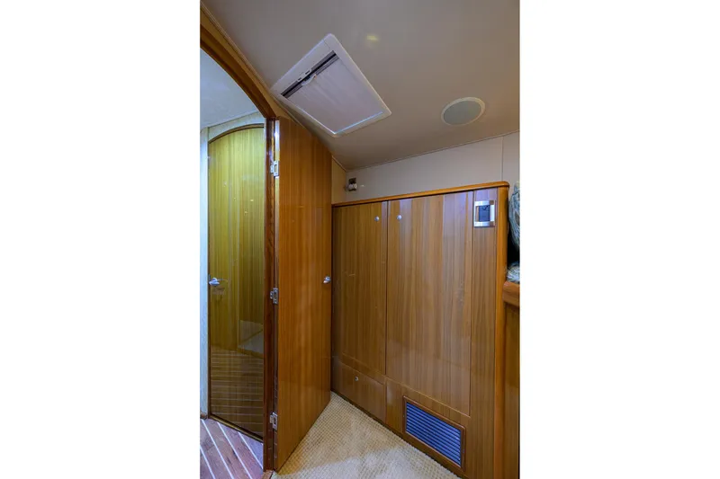 Slide: The Image of Interior of 2007 Viking 56 Convertible yacht with wooden cabinetry and door. - 58