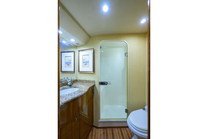 Slide: The Image of Luxurious bathroom in 2007 Viking 56 Convertible yacht with granite countertop and shower. - 60