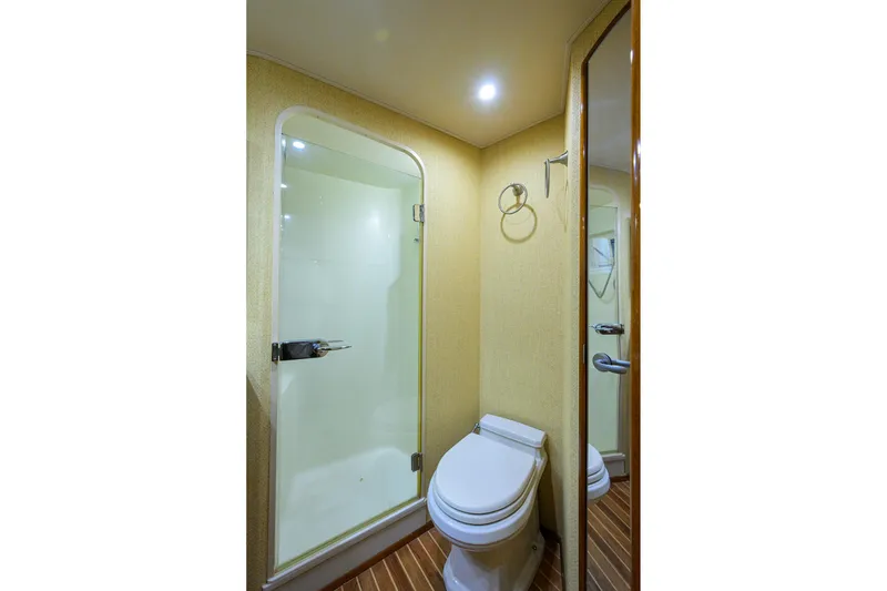Slide: The Image of Bathroom interior of 2007 Viking 56 Convertible yacht with shower and toilet. - 62