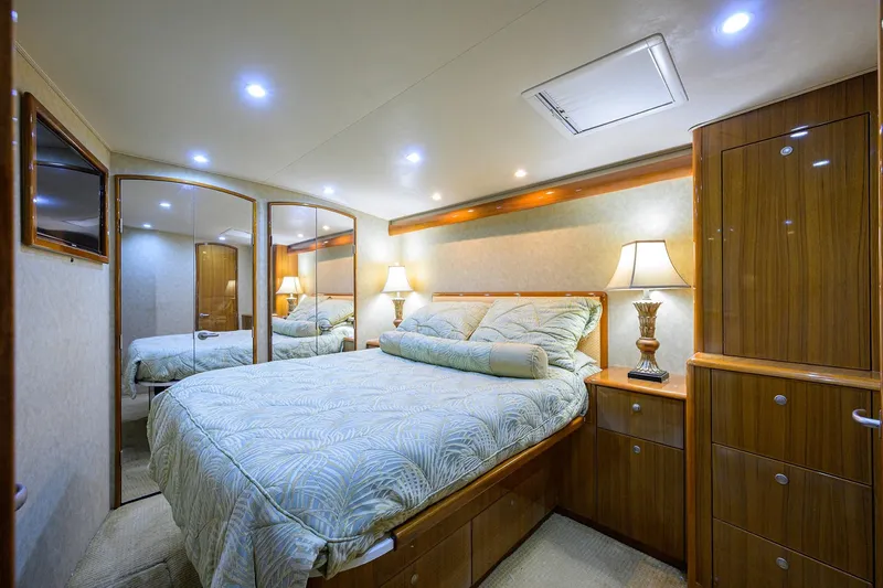 Slide: The Image of Luxurious bedroom interior of 2007 Viking 56 Convertible yacht with elegant wood finishes. - 65