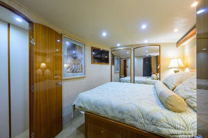 Slide: The Image of Luxurious bedroom interior of 2007 Viking 56 Convertible yacht with elegant decor and lighting. - 66