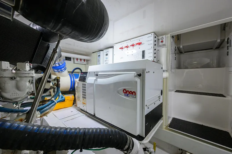Slide: The Image of Engine room of 2007 Viking 56 Convertible yacht with Onan generator and control panels. - 74