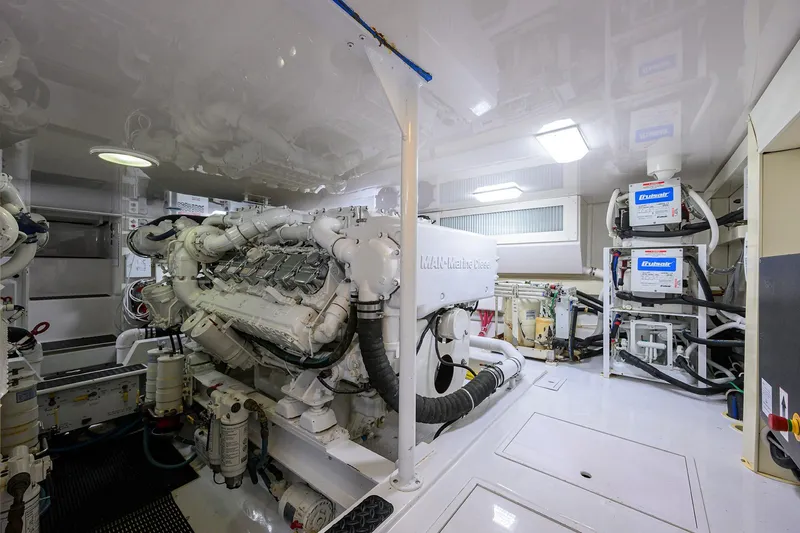 Slide: The Image of Engine room of a 2007 Viking 56 Convertible yacht, featuring MAN marine diesel engines. - 78