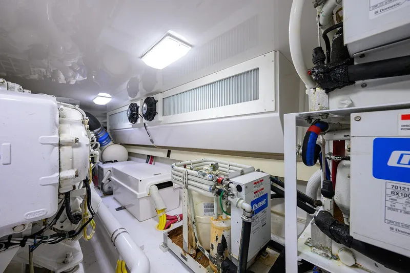 Slide: The Image of Engine room of a 2007 Viking 56 Convertible yacht, showcasing machinery and equipment. - 80