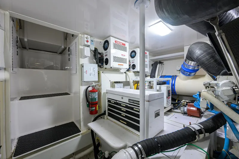 Slide: The Image of Engine room of 2007 Viking 56 Convertible yacht with equipment and storage. - 82