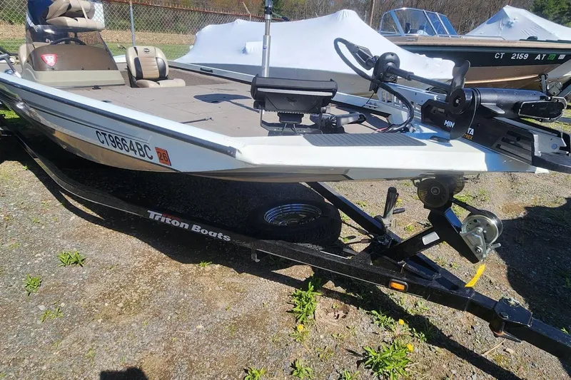 Slide: The Image of 2008 Triton VT 19 boat on trailer, equipped with Minn Kota trolling motor. - 4