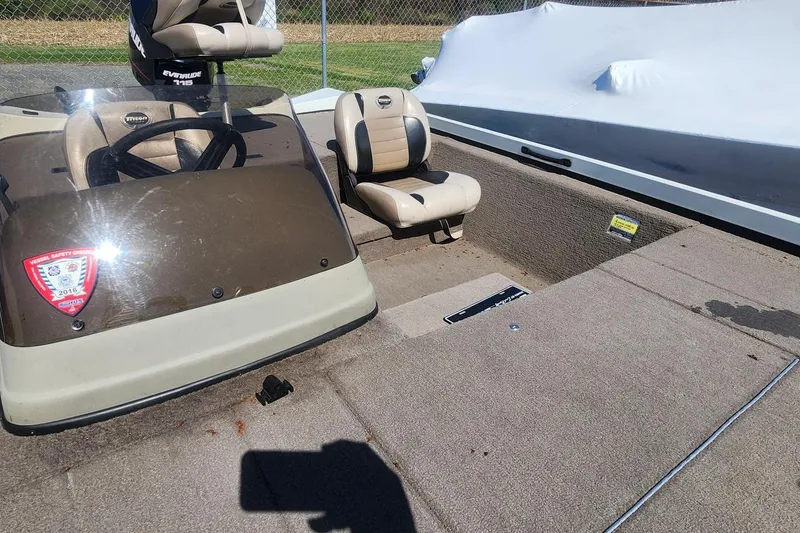 Slide: The Image of 2008 Triton VT 19 boat interior with steering wheel and seating. - 8