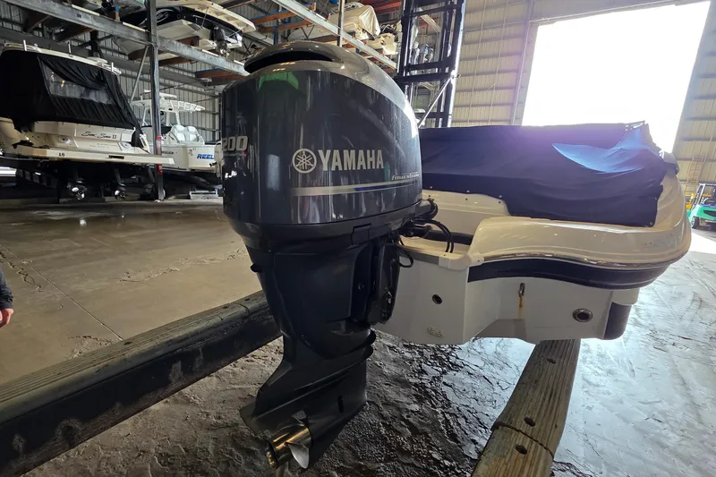 Slide: The Image of 2012 SouthWind 2400 SD boat with Yamaha outboard motor in storage facility. - 11