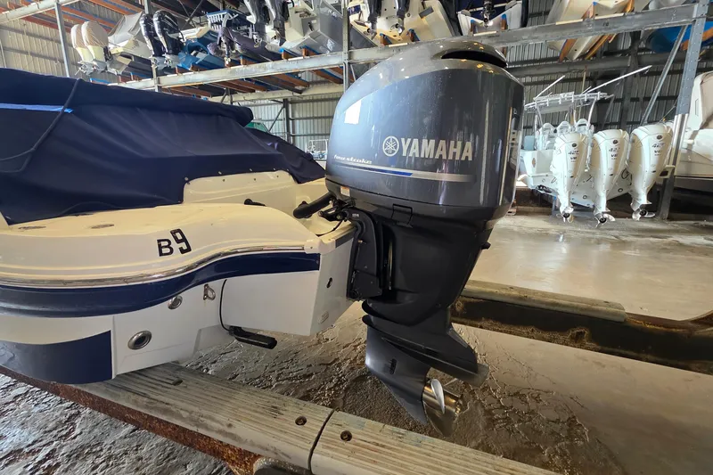 Slide: The Image of 2012 SouthWind 2400 SD boat with Yamaha outboard motor in storage facility. - 12