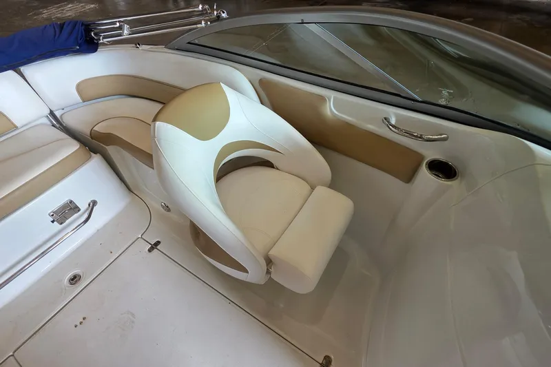Slide: The Image of 2012 SouthWind 2400 SD boat interior with beige and white seating. - 29