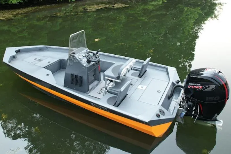 The Image of 2026 Excel 203 Bay Pro Elite boat with Mercury engine on calm water. - 1