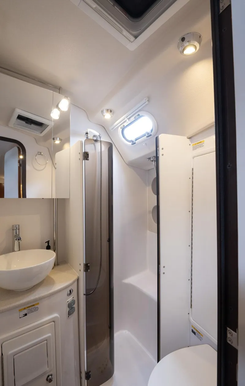 Slide: The Image of 2024 Catalina 445 yacht bathroom with modern fixtures and natural lighting. - 11