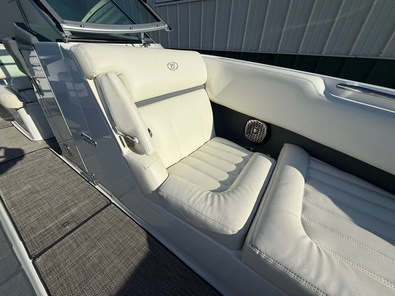 Slide: The Image of Interior of a 2015 Cobalt R7 boat with white leather seats. - 14