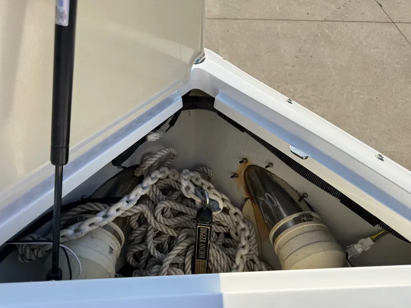 Slide: The Image of Storage compartment in Cobalt R7 boat with ropes and anchor, year 2015. - 19