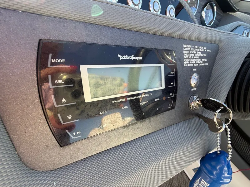 Slide: The Image of Dashboard of 2015 Cobalt R7 with media player and ignition key. - 22