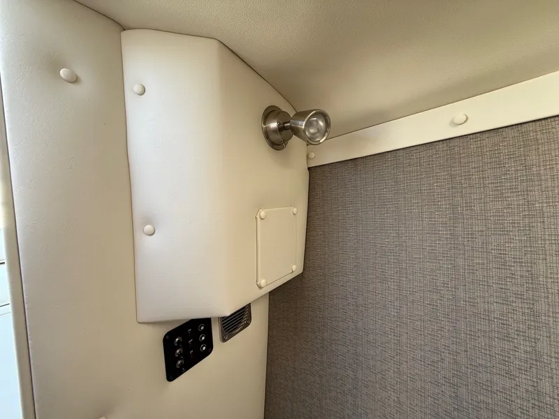Slide: The Image of Interior of a 2015 Cobalt R7 boat with wall paneling. - 26