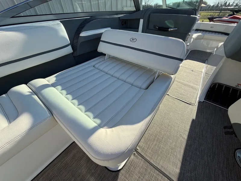 Slide: The Image of Interior of a 2015 Cobalt R7 boat with white leather seats. - 29